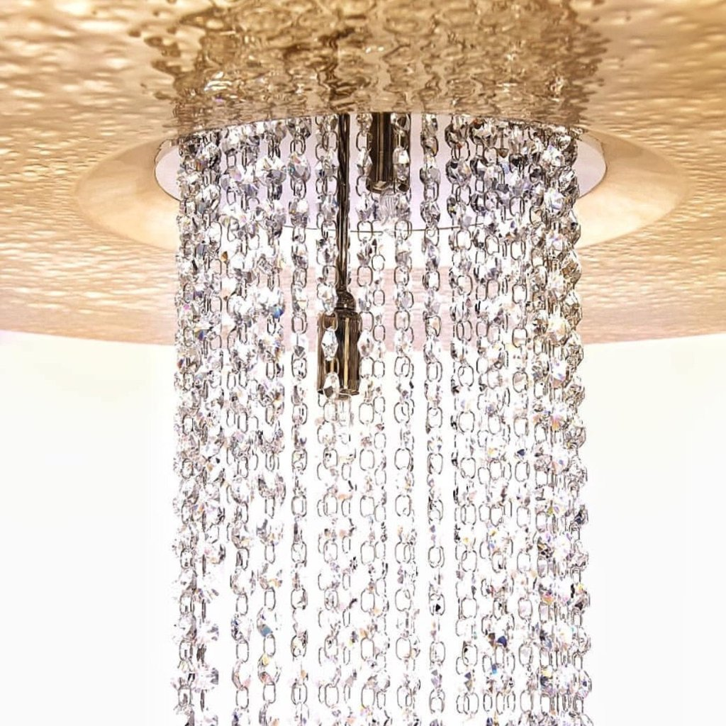 luxurious sophisticated dynamic ceiling lamp chandelier gold Swarovski crystals delicately hammered gold plated brass